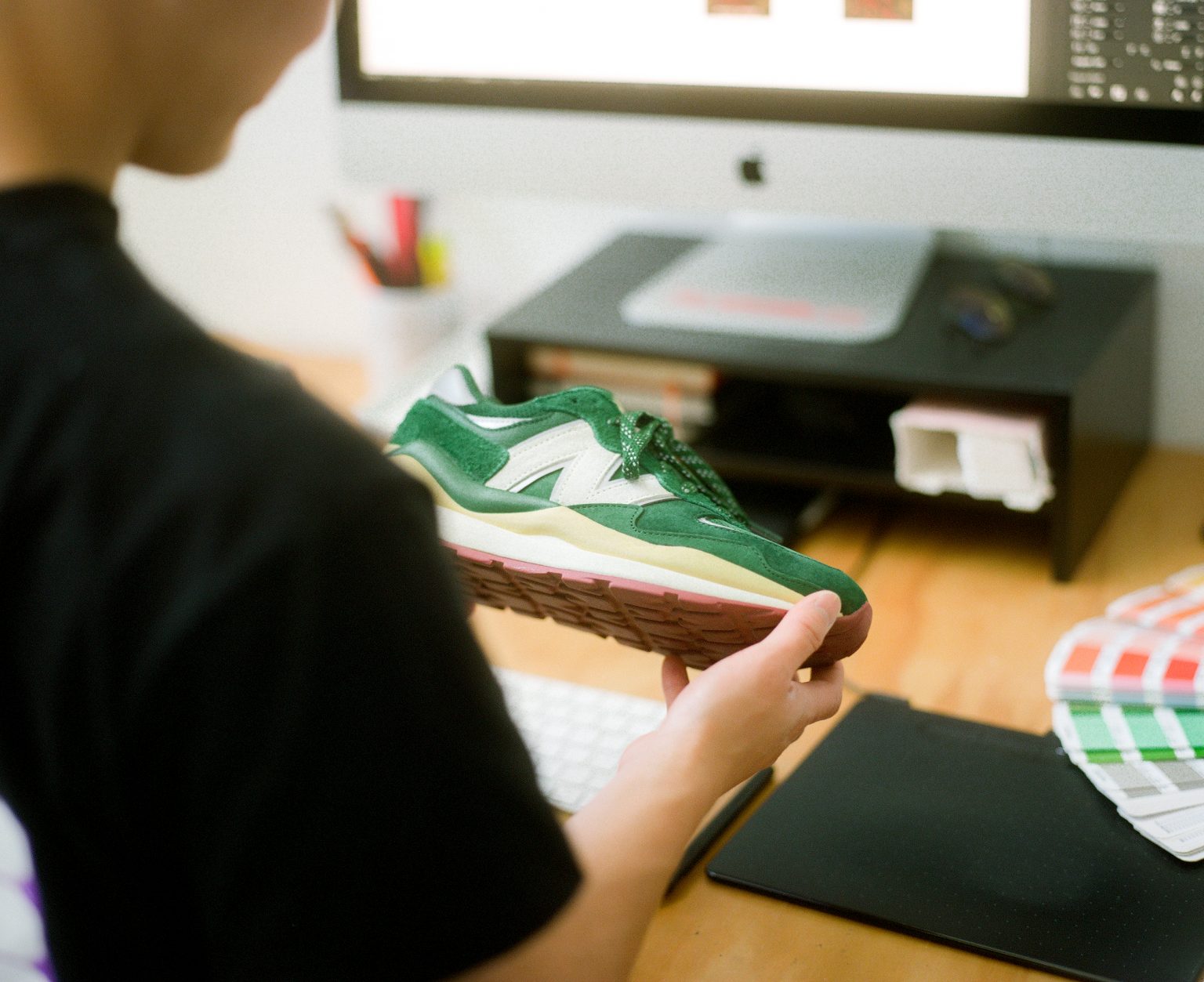 Kevin Wong holding the Bricks & Wood New Balance 57/40